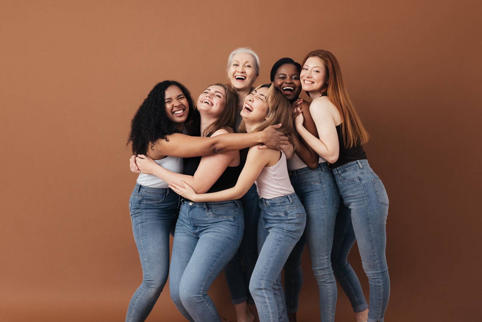 Six laughing women of a different race