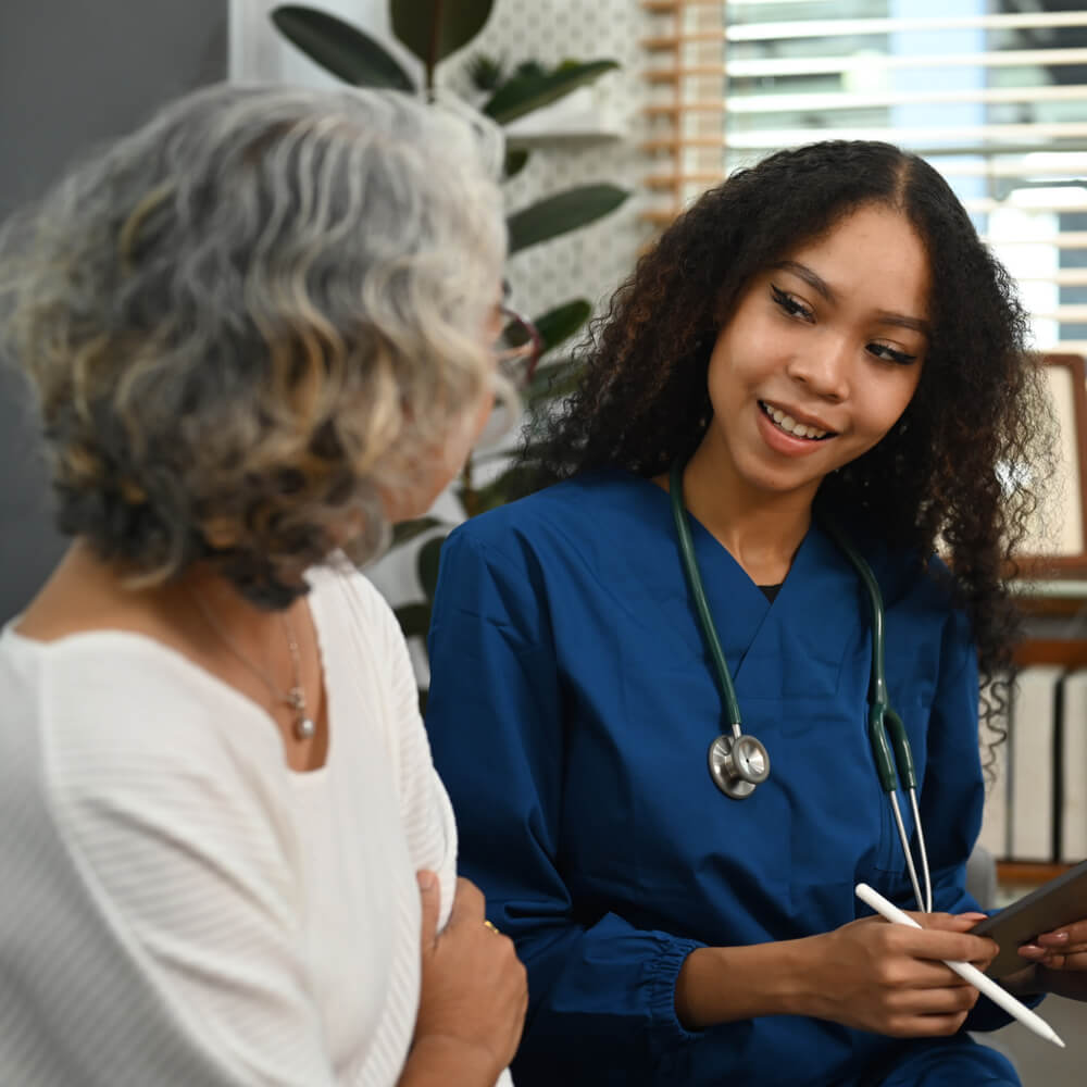 Caring female doctor explaining the medical results to the senior woman