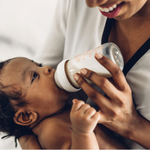 african american mother playing with adorable little african american baby