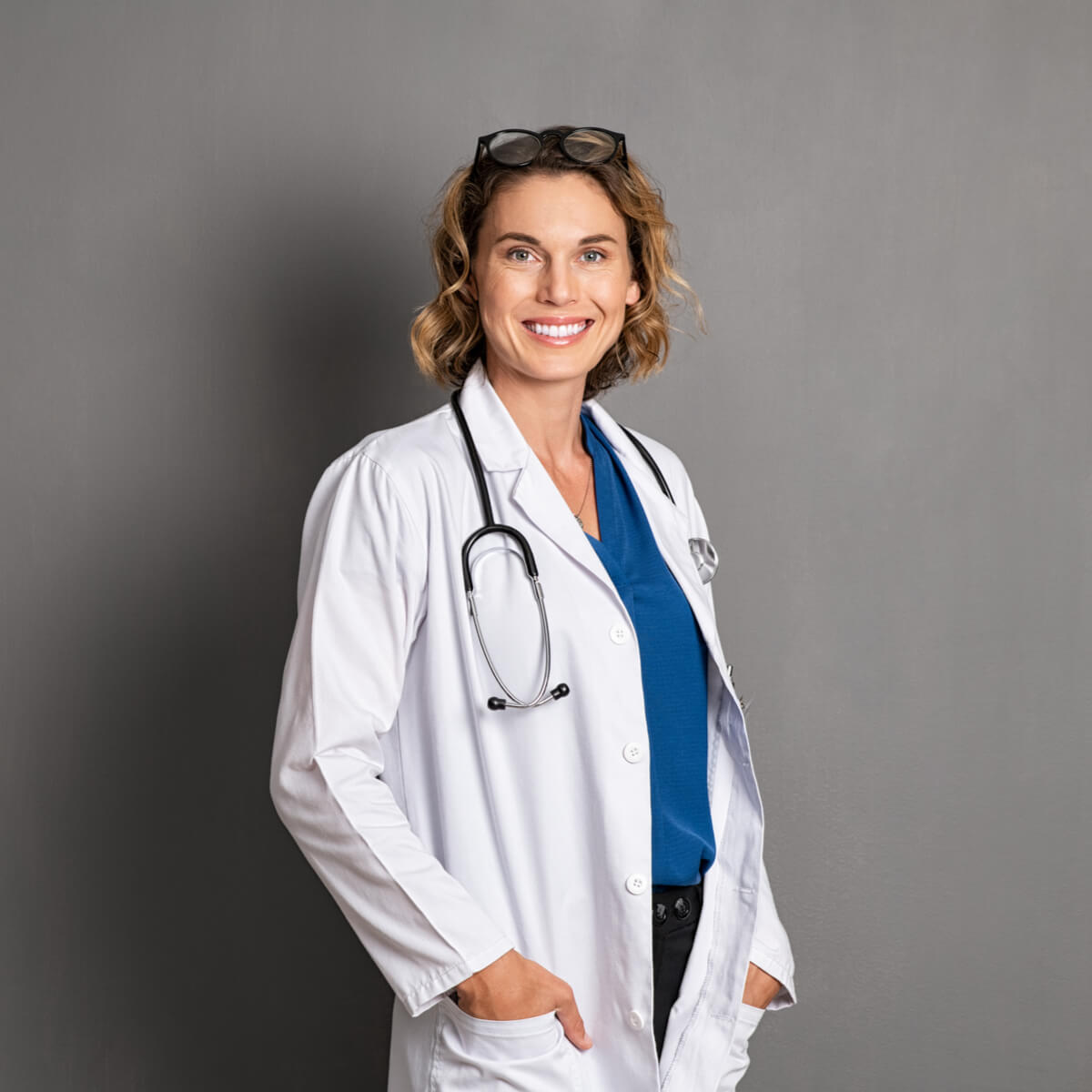 Confident mature doctor in labcoat with stethoscope